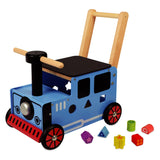 Soy un juguete que camina y empuja un tren de vagones.