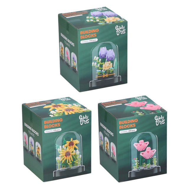 Bloques de construcción de flores en una campana de vidrio