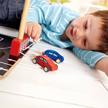 Hape park go garage - garaje de juguete con ascensor, helicóptero y coches, a partir de 3 años